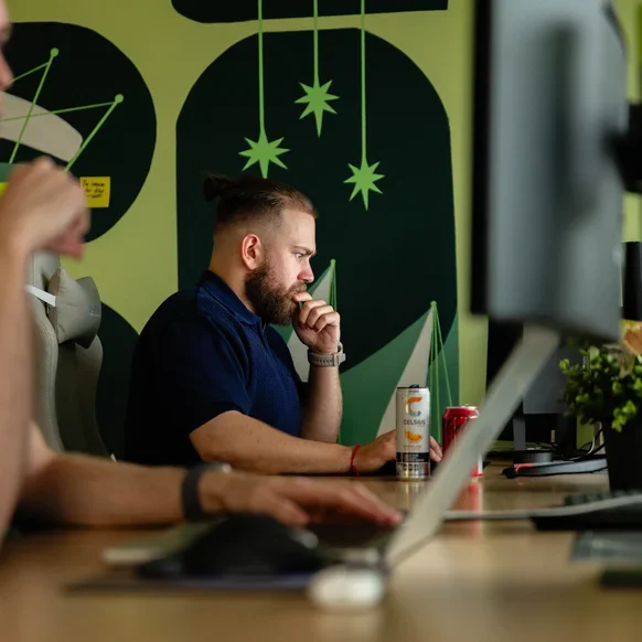 A Setsail Account Strategist at a desk in the studio