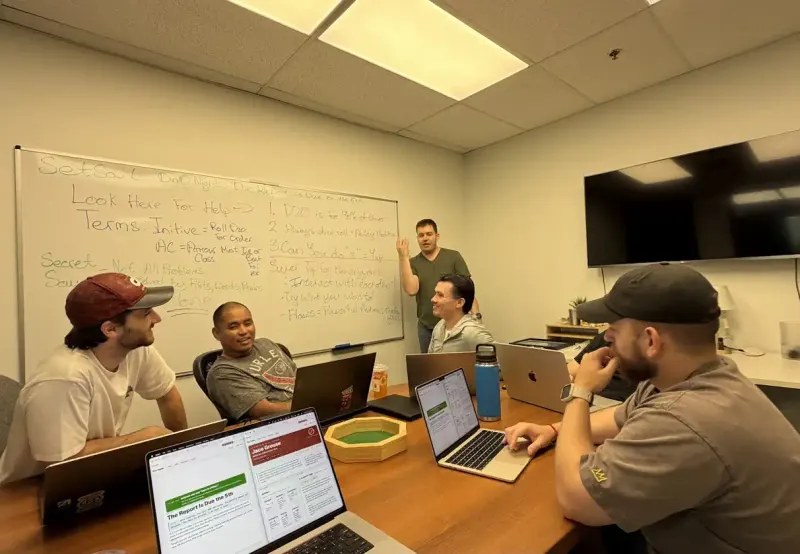The Setsail team planning around a whiteboard