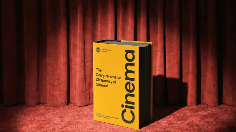 The Comprehensive Dictionary of Cinema on red carpet in front of a red velvet curtain, from our studio shoot