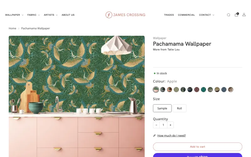 A James Crossing wallpaper page on a laptop: Pachamama Wallpaper, with twelve colourway swatches beside the photo