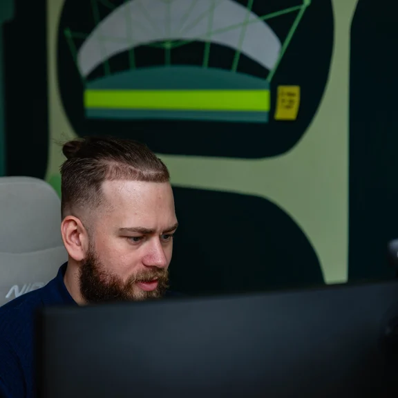 A Setsail Shopify developer at his desk