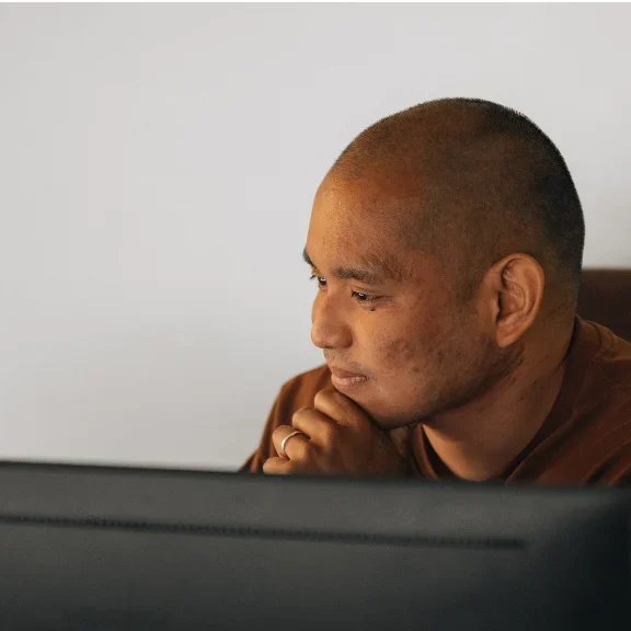 A Setsail paid media specialist studying his screen