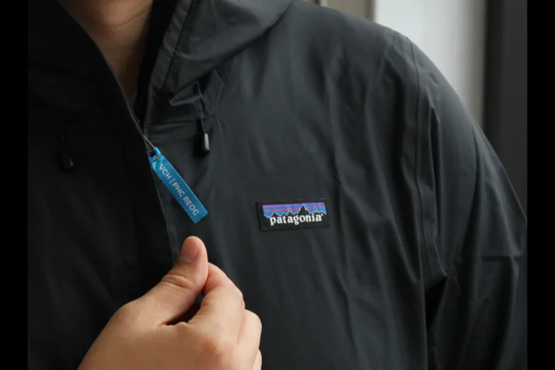 A dark jacket with a Patagonia patch, from Fairware’s merchandise