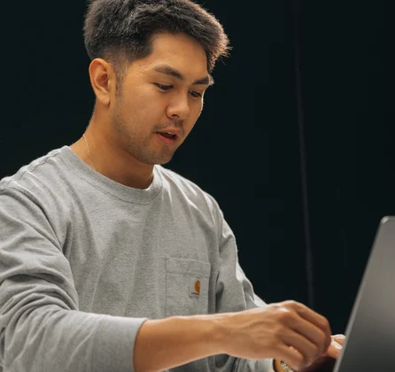 A Setsail team member at a laptop