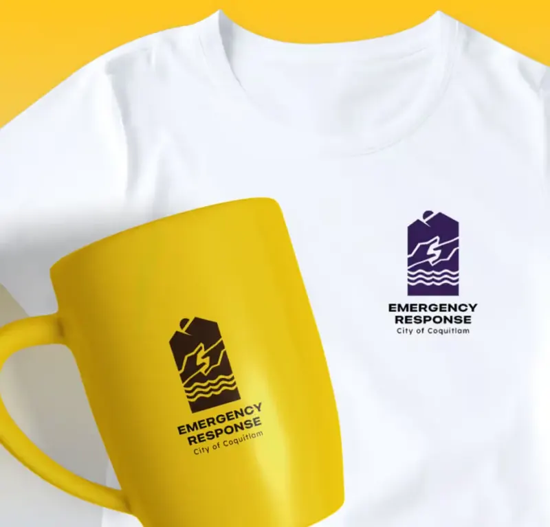 Coquitlam Emergency Response logo printed on a white t-shirt and a yellow mug in purple and brown