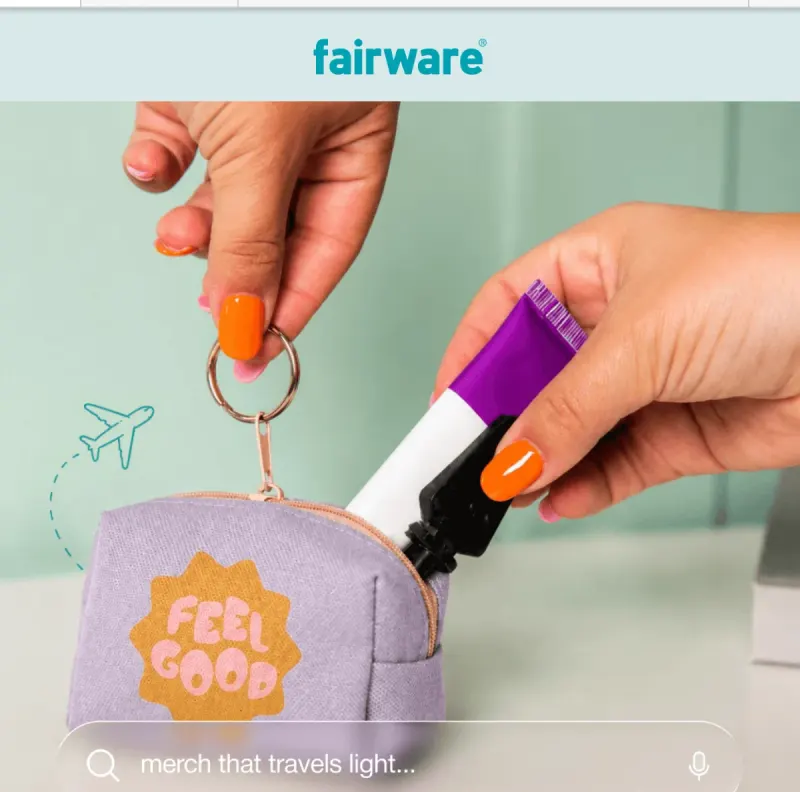 Fairware email “Merch That Travels Light”, opening on a lilac Feel Good pouch clipped to a key ring
