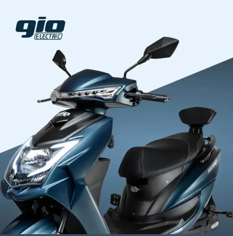 Close-up of a blue GIO Electric scooter front and seat against a two-tone blue backdrop