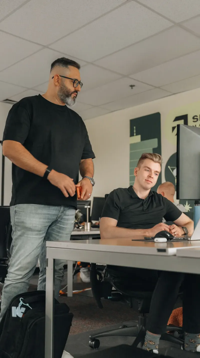 Two Setsail team members reviewing a screen together