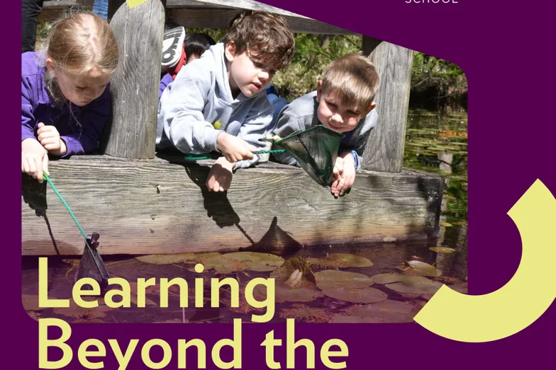 Children leaning over a wooden rail outdoors, under the line “Learning beyond the”