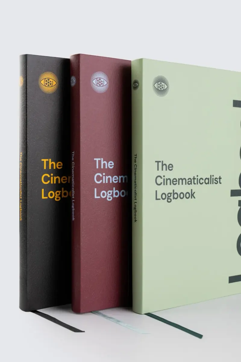 Three Logbooks in black, burgundy and sage standing together