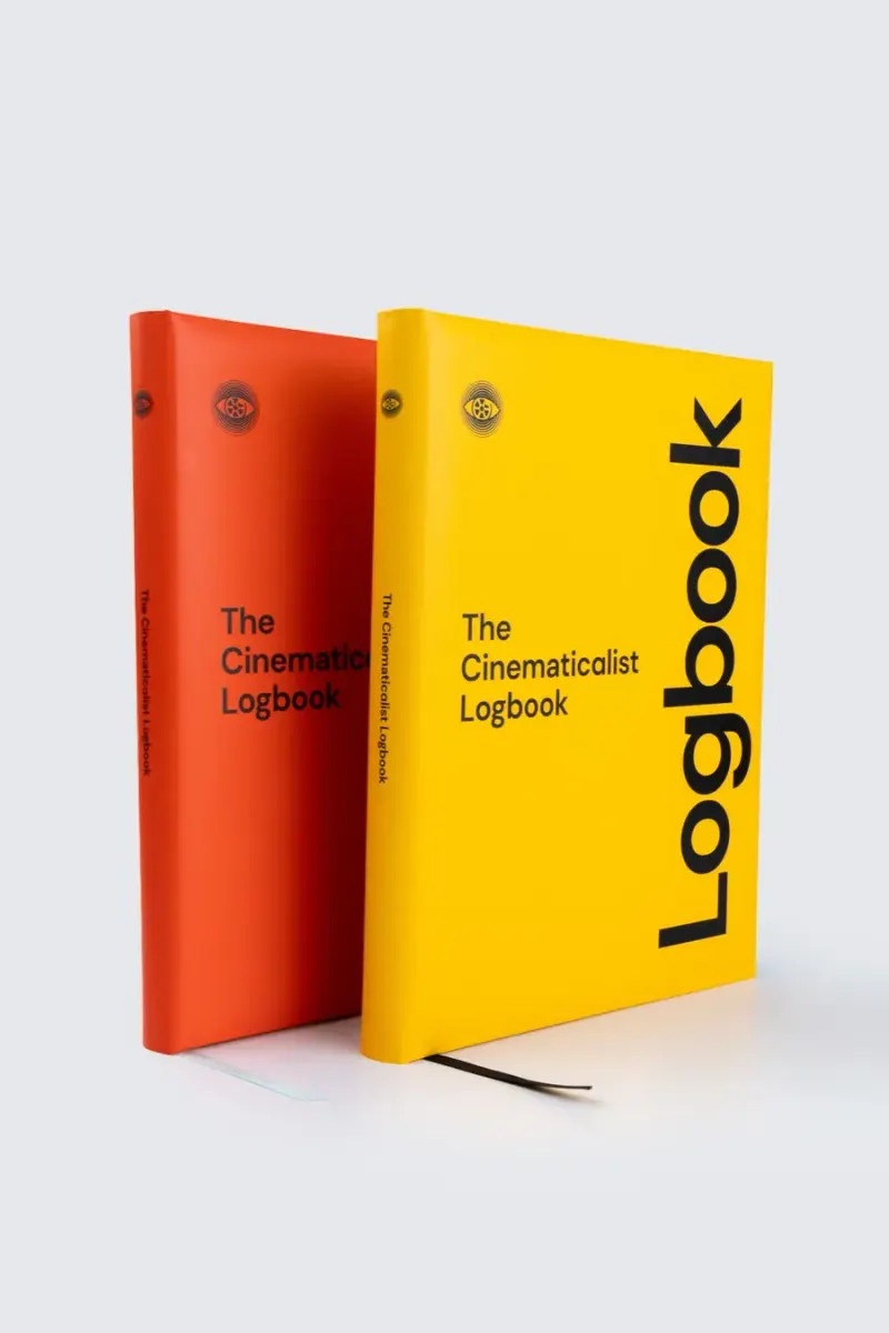 Orange and yellow Logbooks standing as a pair