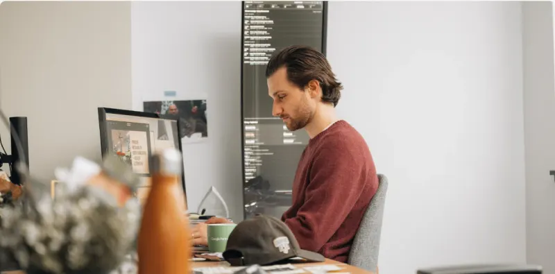 A Setsail team member at his desk in the studio