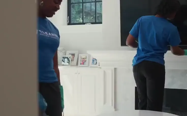 A PNJ Cleaners crew member cleaning a kitchen, from an ad Setsail made