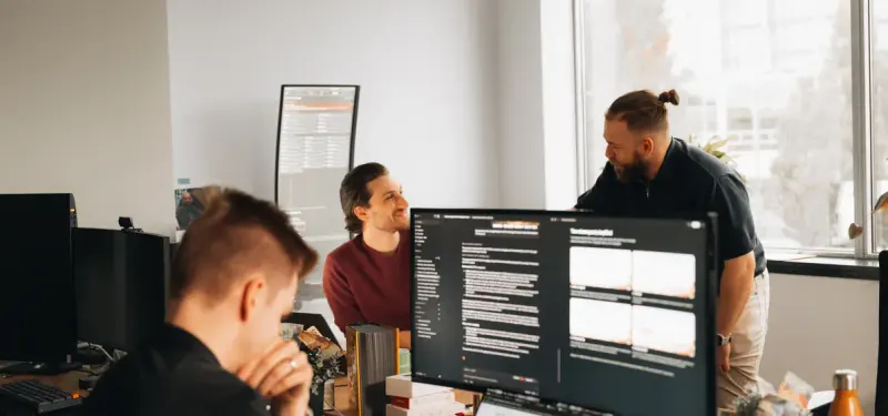 The Setsail team at their desks by a window