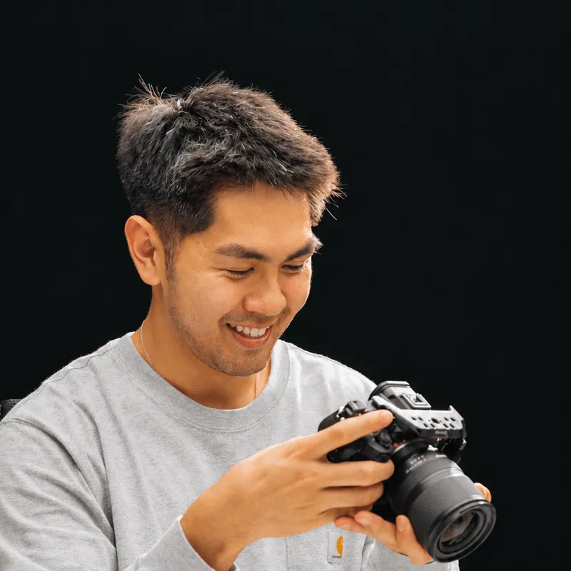 Preston Szeto holding a camera