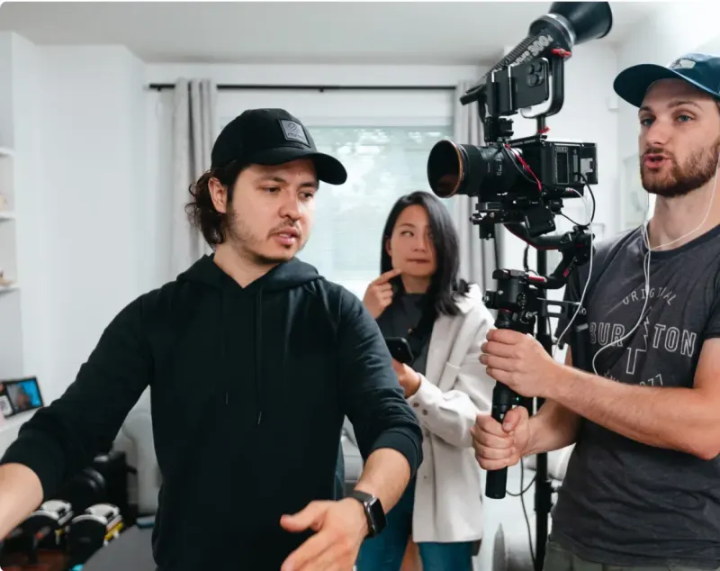 A Setsail crew filming in a client's home with a camera on a gimbal