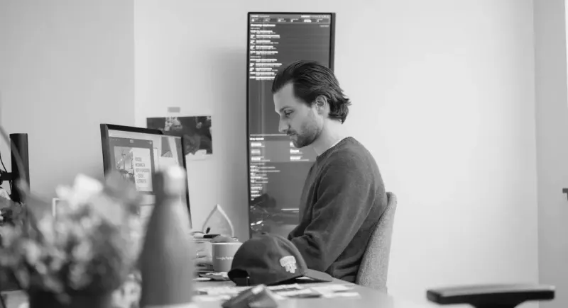 A Setsail team member working at his desk in the studio