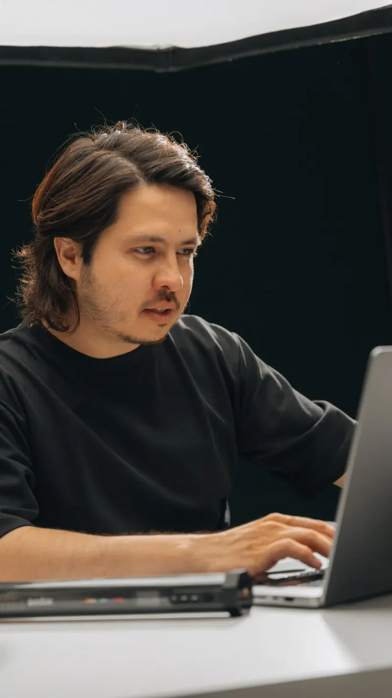 A Setsail team member focused on his laptop