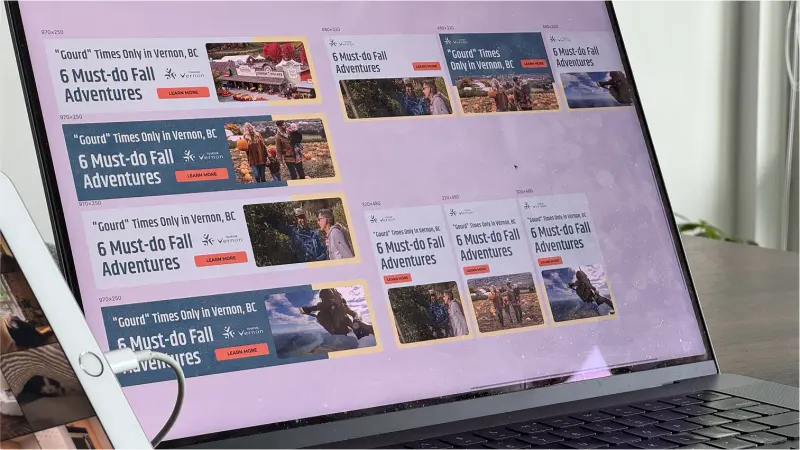 Laptop screen showing Tourism Vernon fall campaign display ads in several banner sizes