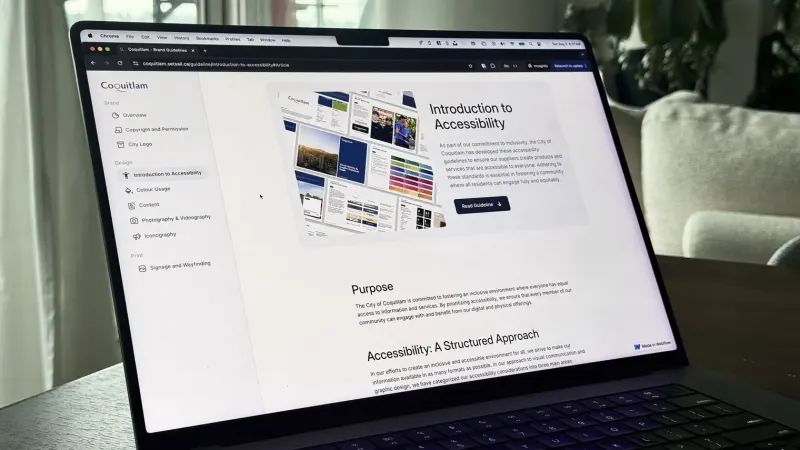 Laptop showing the Coquitlam online brand guidelines site on an Introduction to Accessibility page with a sidebar menu