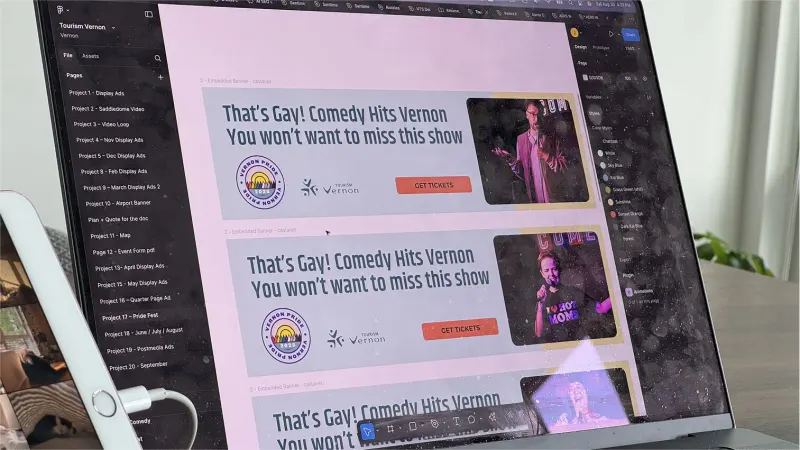 Laptop with Figma open showing Tourism Vernon Pride Fest banner ads for a comedy show with "Get Tickets" buttons