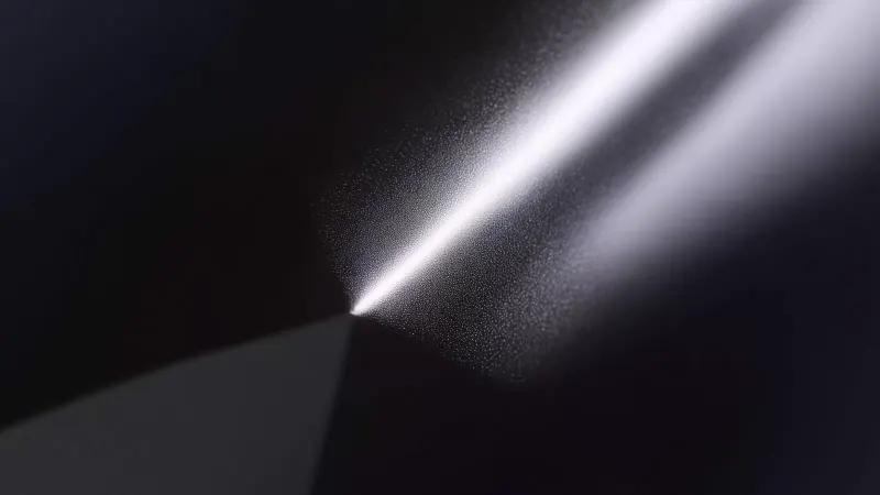 A beam of light cutting across a dark background.