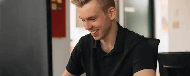 A Setsail strategist smiling at his screen