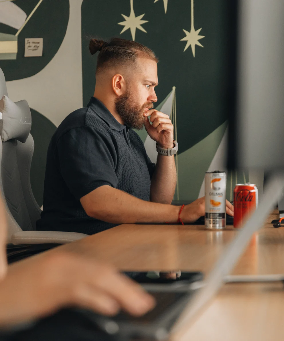 A Setsail Marketing strategist thinking through a client's search plan at his desk